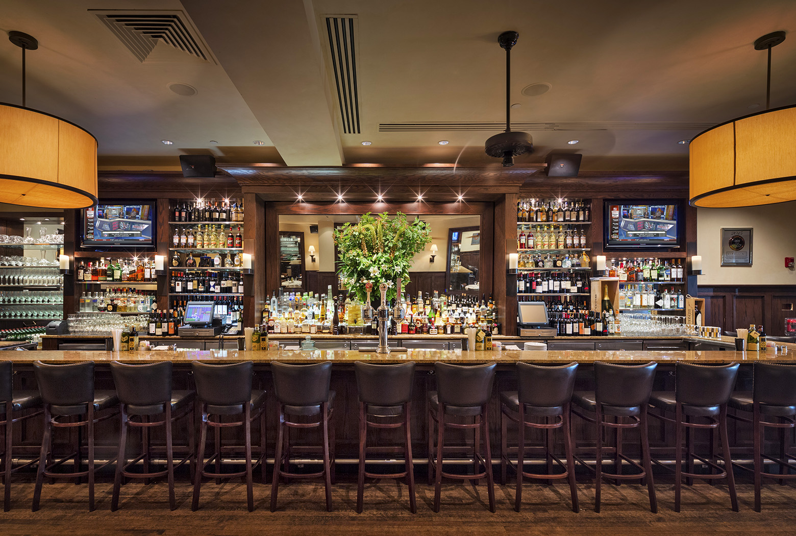a group of people sitting at a table in a restaurant