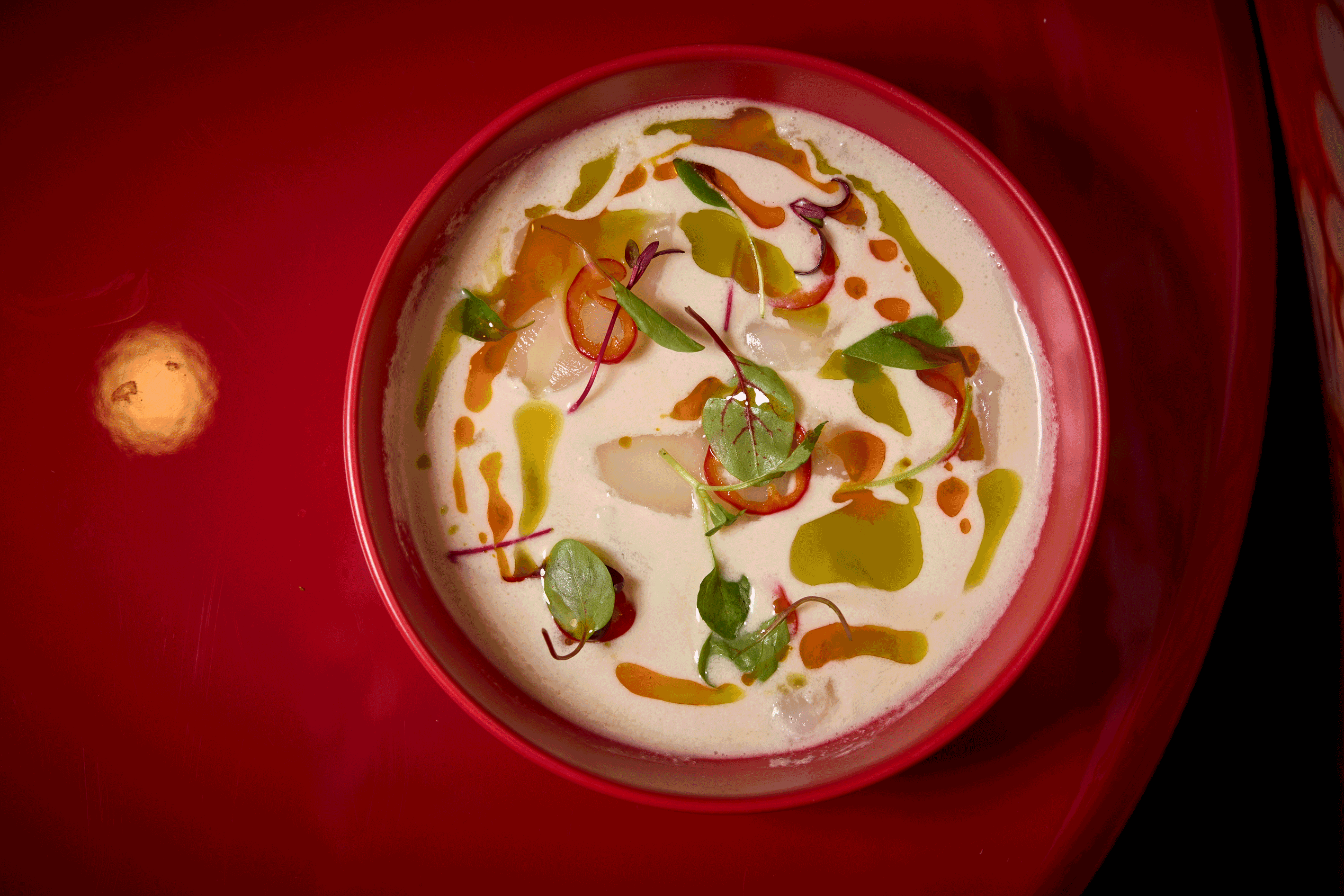 a bowl of soup with vegetables and sauce