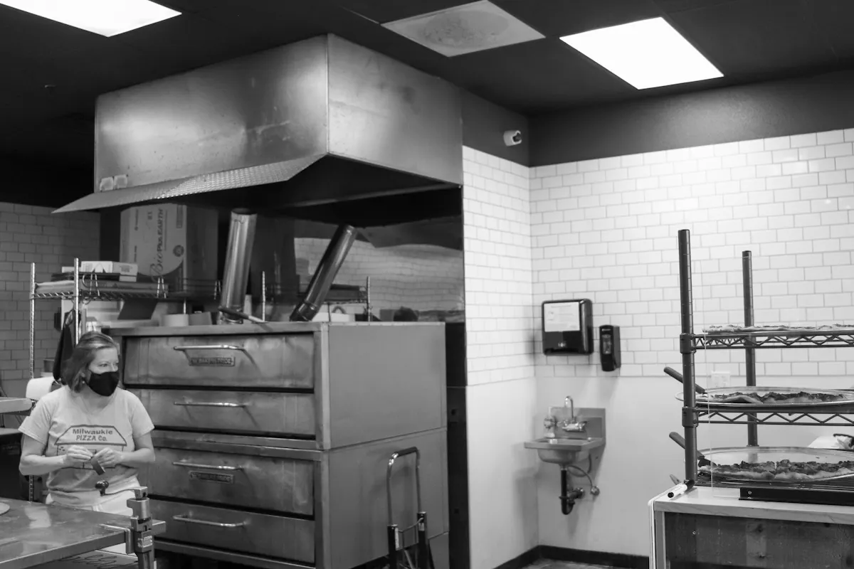 a person cooking in a kitchen