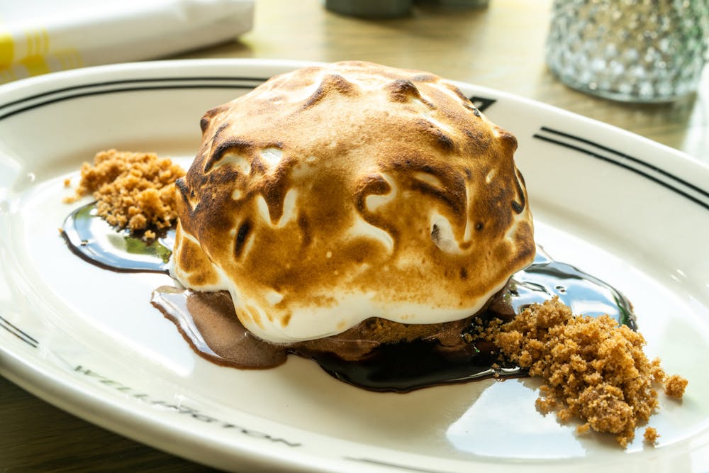 a plate with a piece of cake on a table