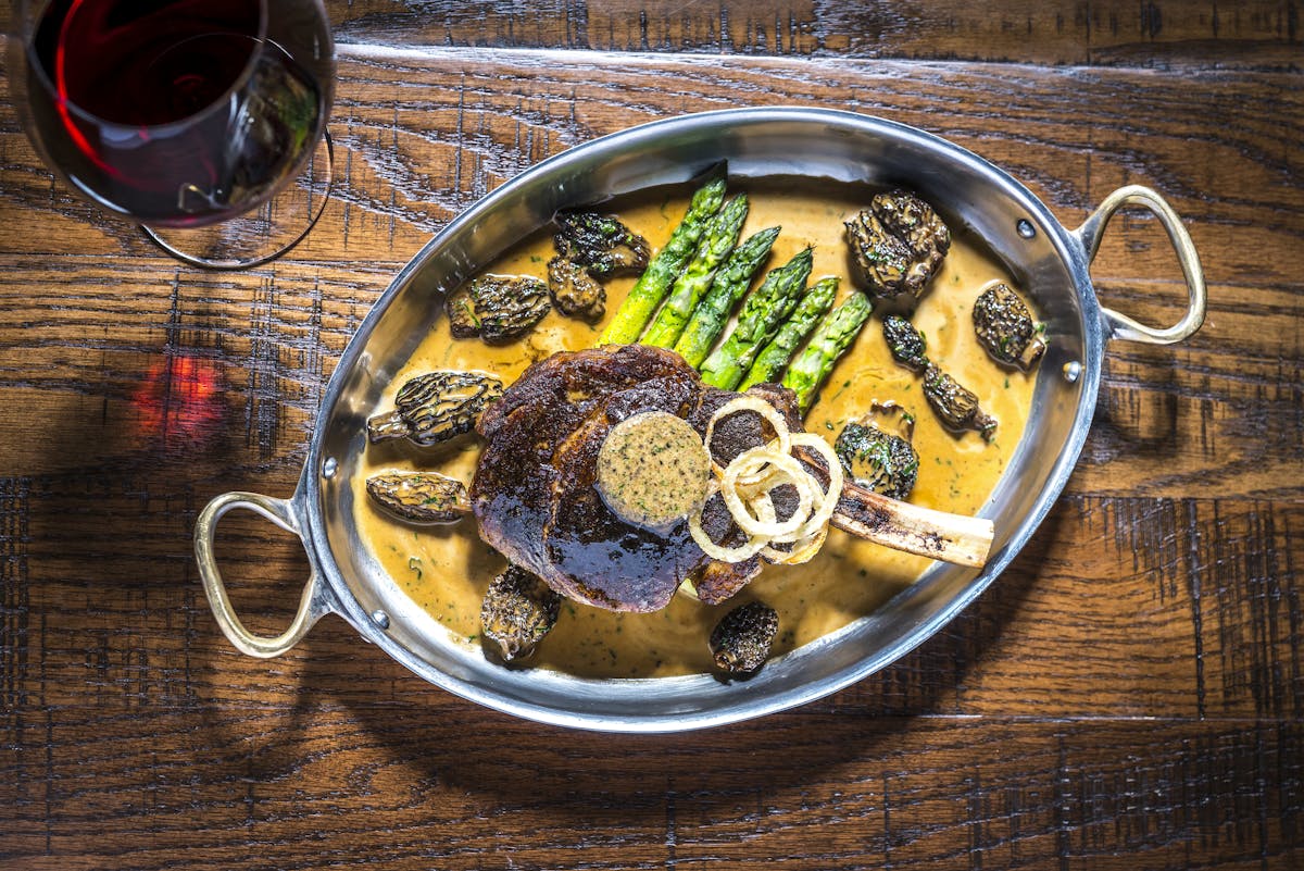 a plate of food on a wood table