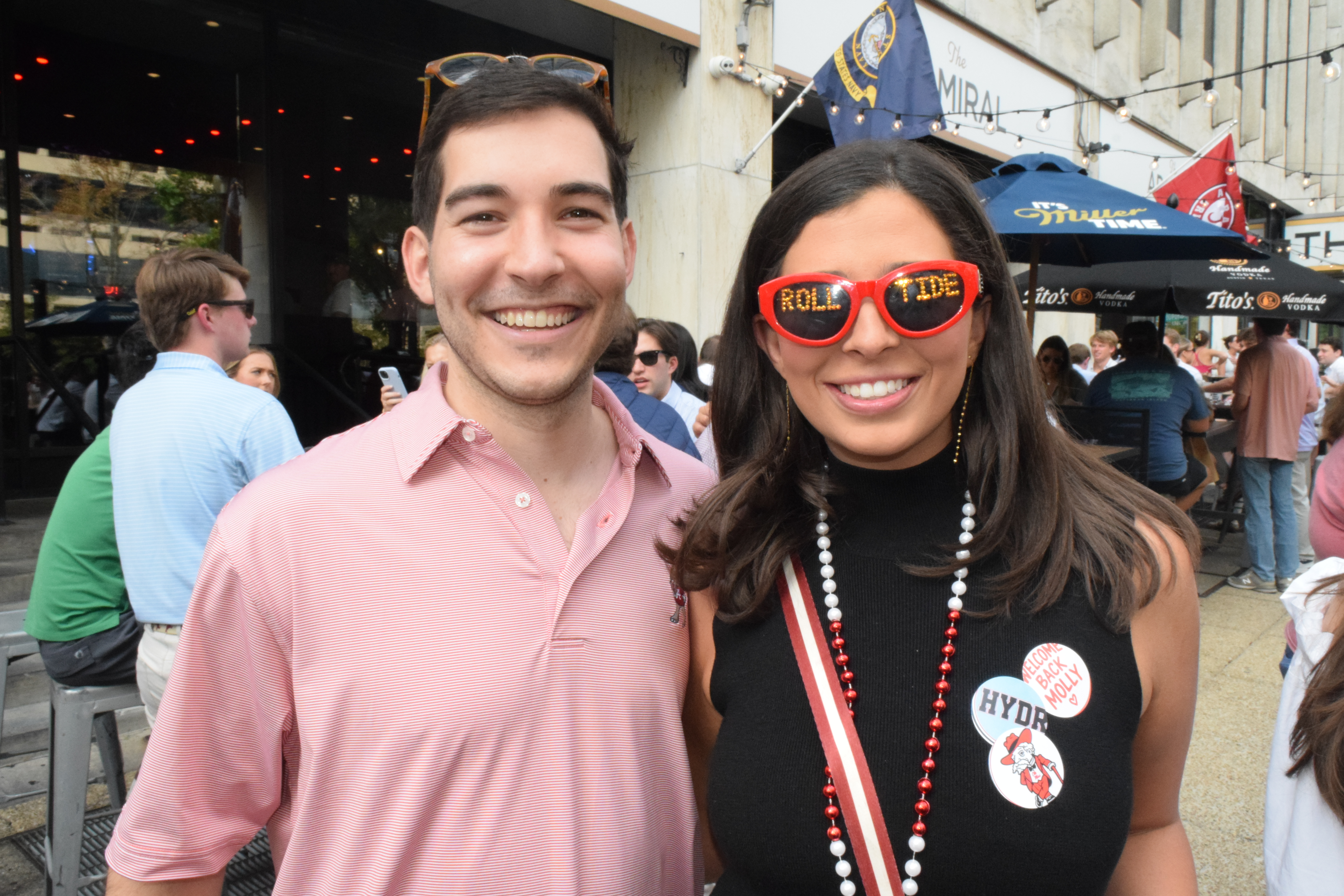 a man and woman smiling at camera