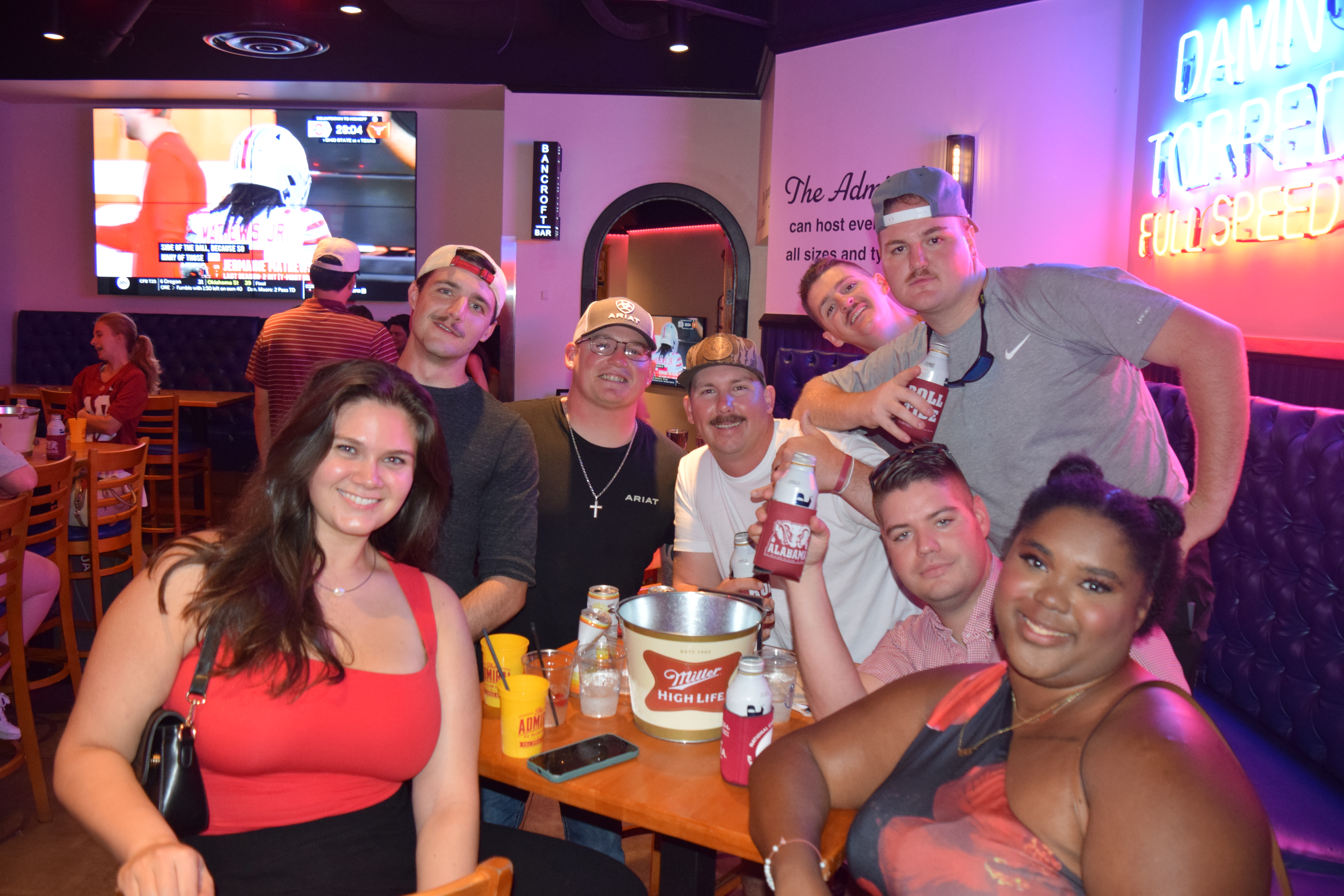 a group of people sitting around a table