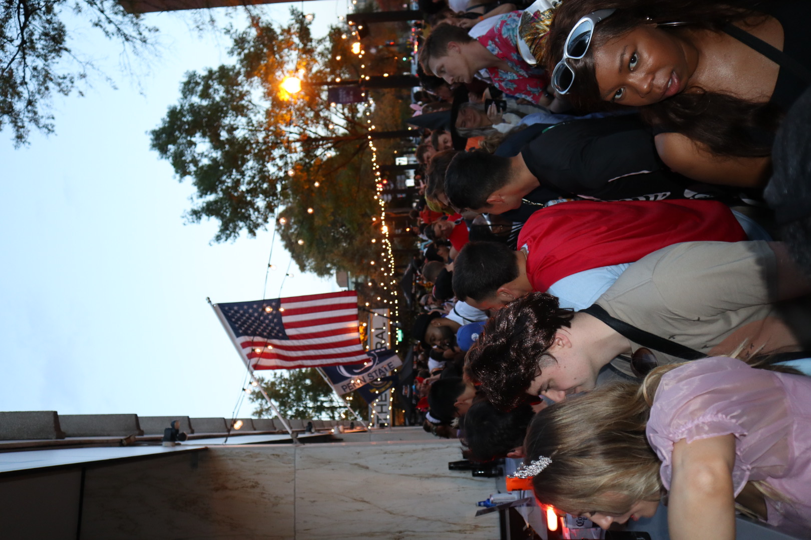 a group of people standing in front of a crowd