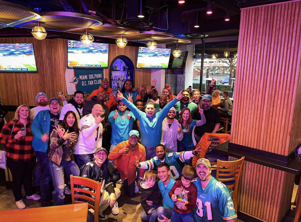 a crowd of people cheering on their team