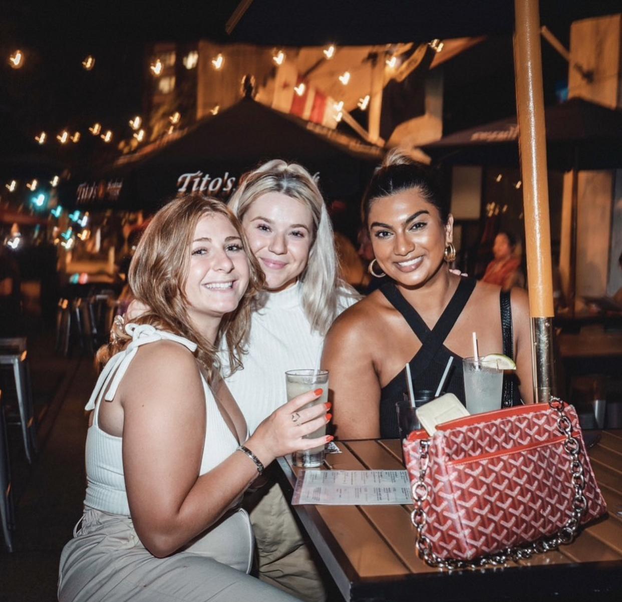 a couple of people sitting posing for the camera