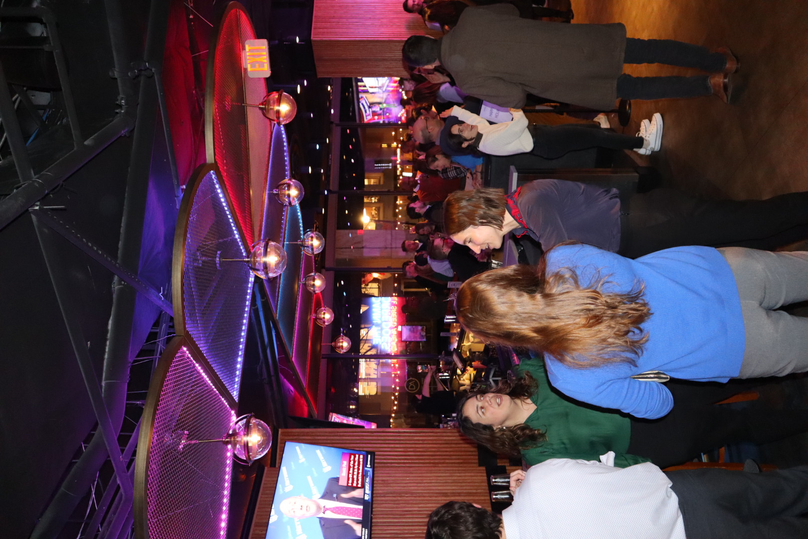 a group of people standing in front of a crowd