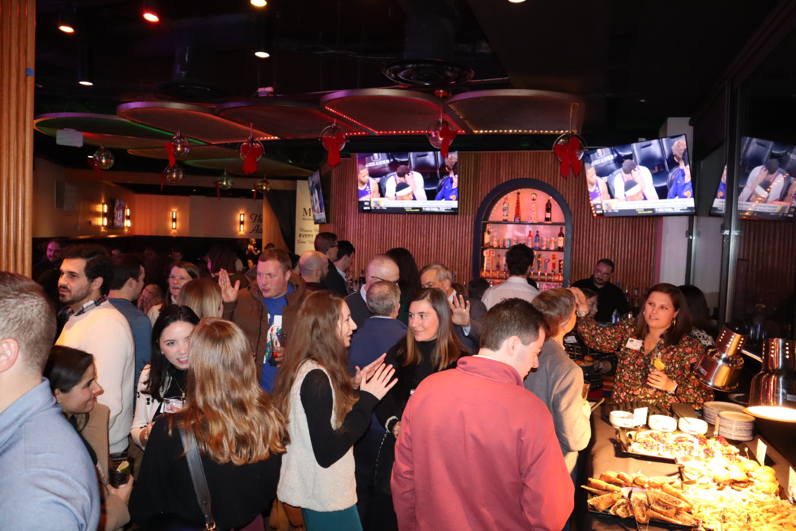 a group of people sitting at a table in a restaurant