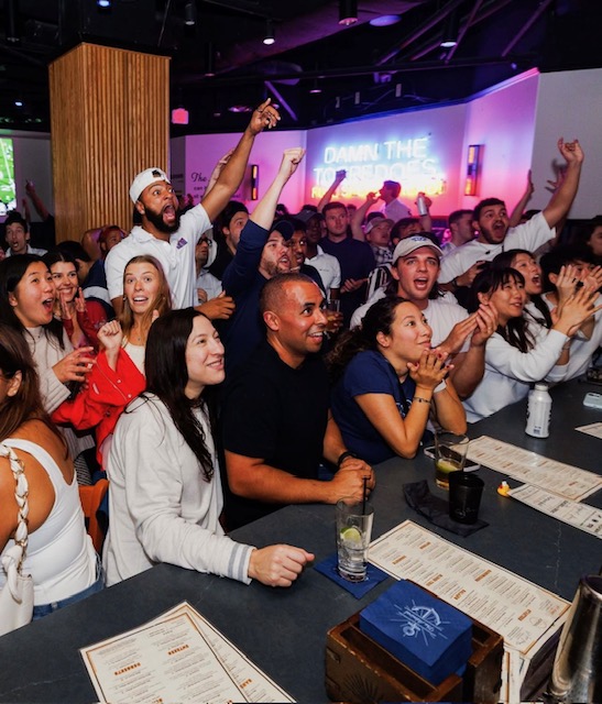 a group of people sitting at a table