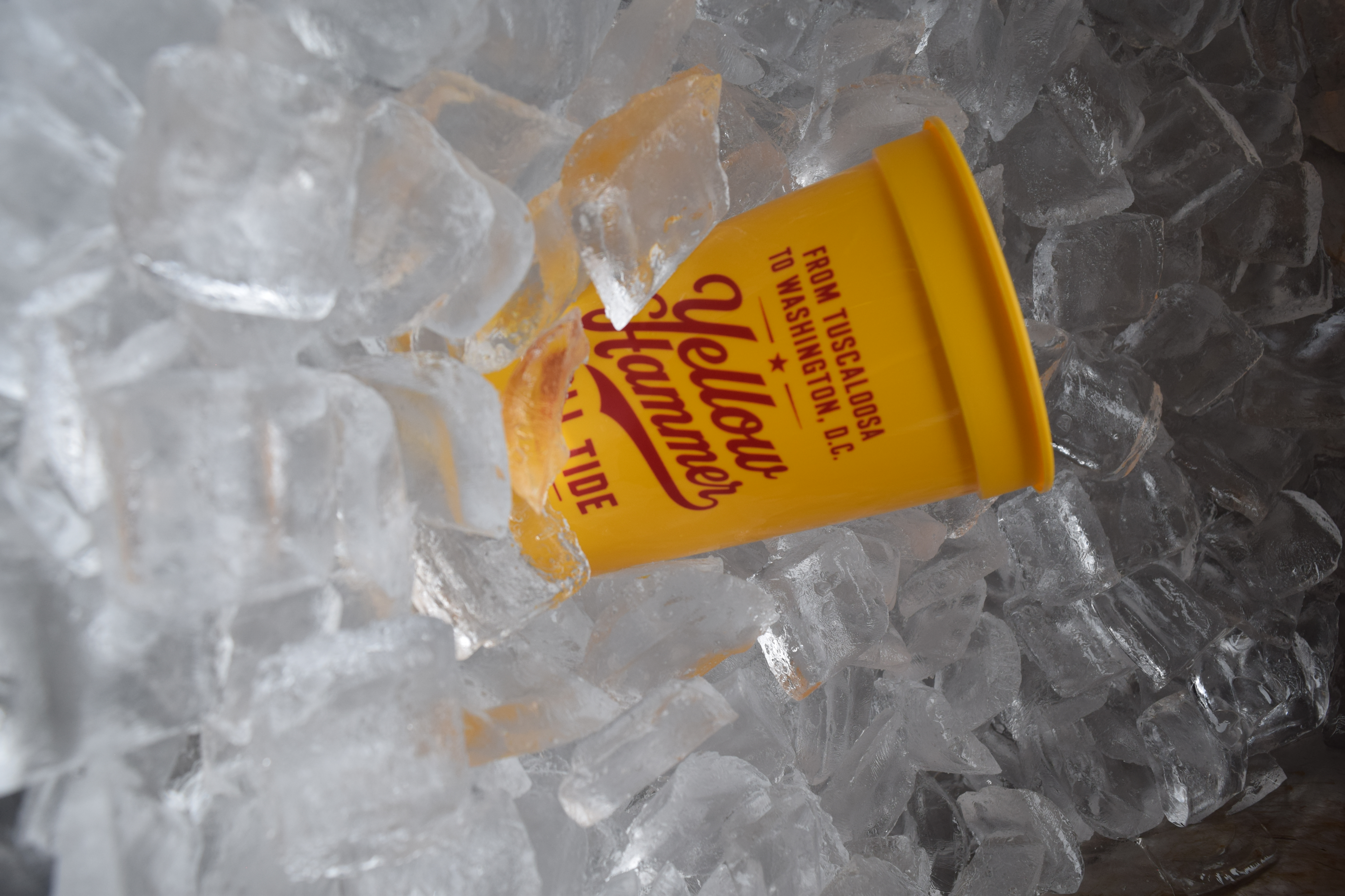 a yellow cup in ice