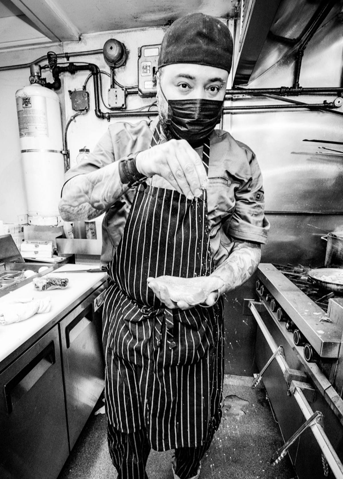 a chef in a striped apron