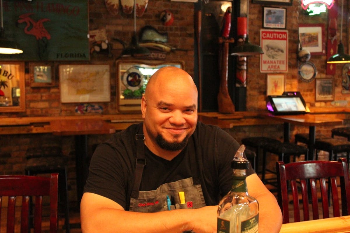 a man sitting at a table in a restaurant