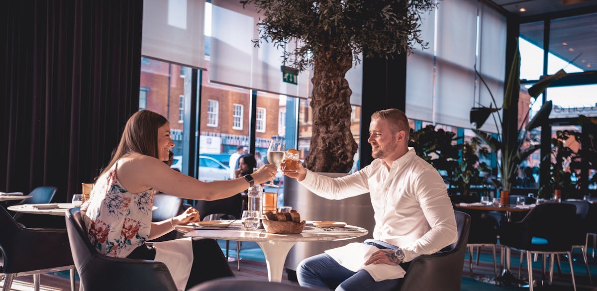 a man and a woman sitting at a table
