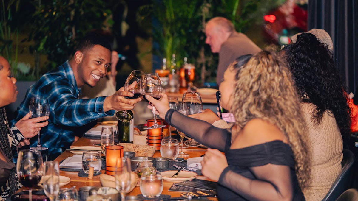 a group of people sitting at a table