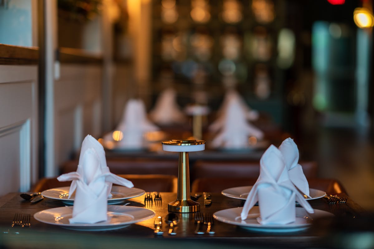 a person sitting at a table in a restaurant