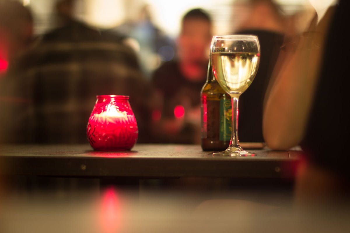 a close up of a glass of red wine