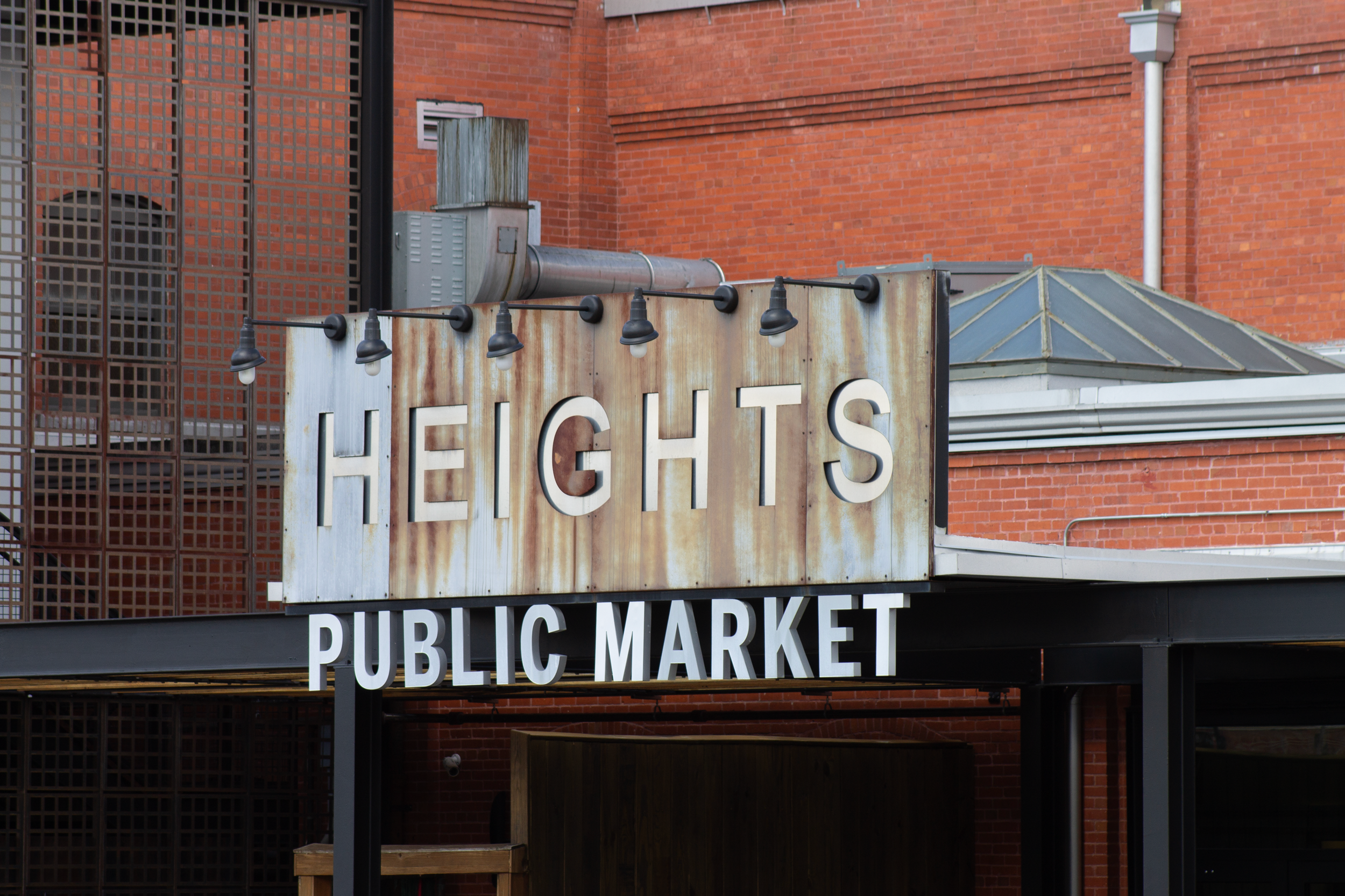 a sign in front of a brick building