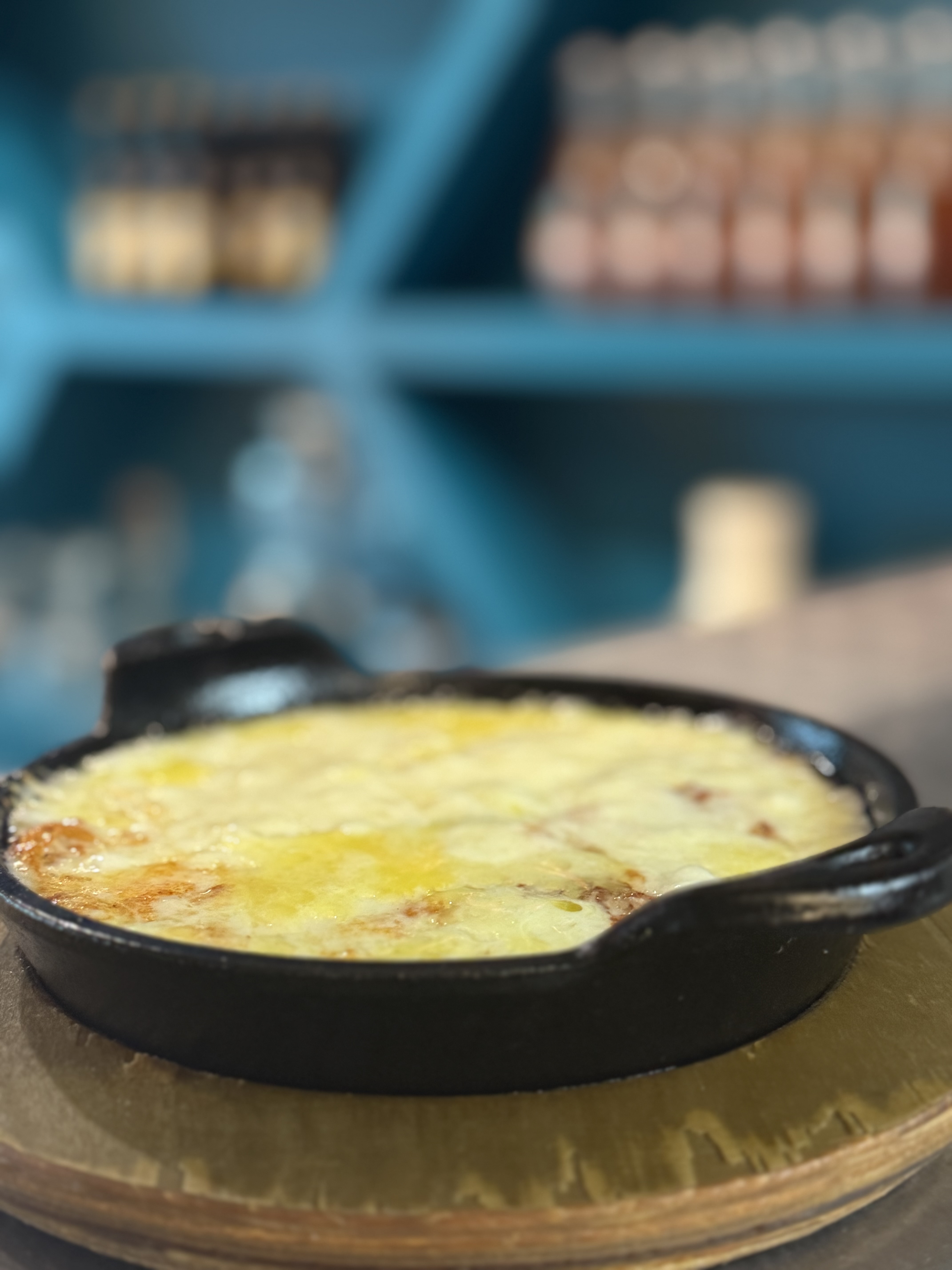 a skillet of food on a wood surface