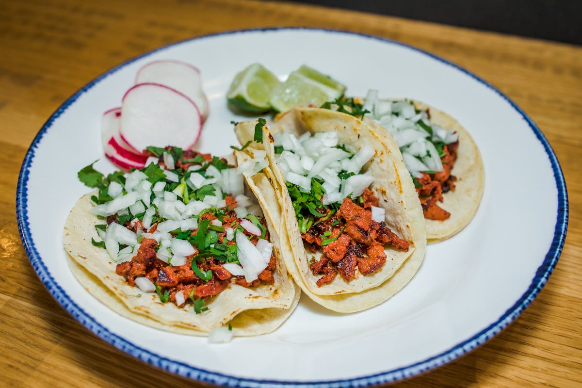 a plate of three tacos