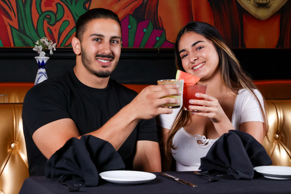a person sitting at a table in a restaurant