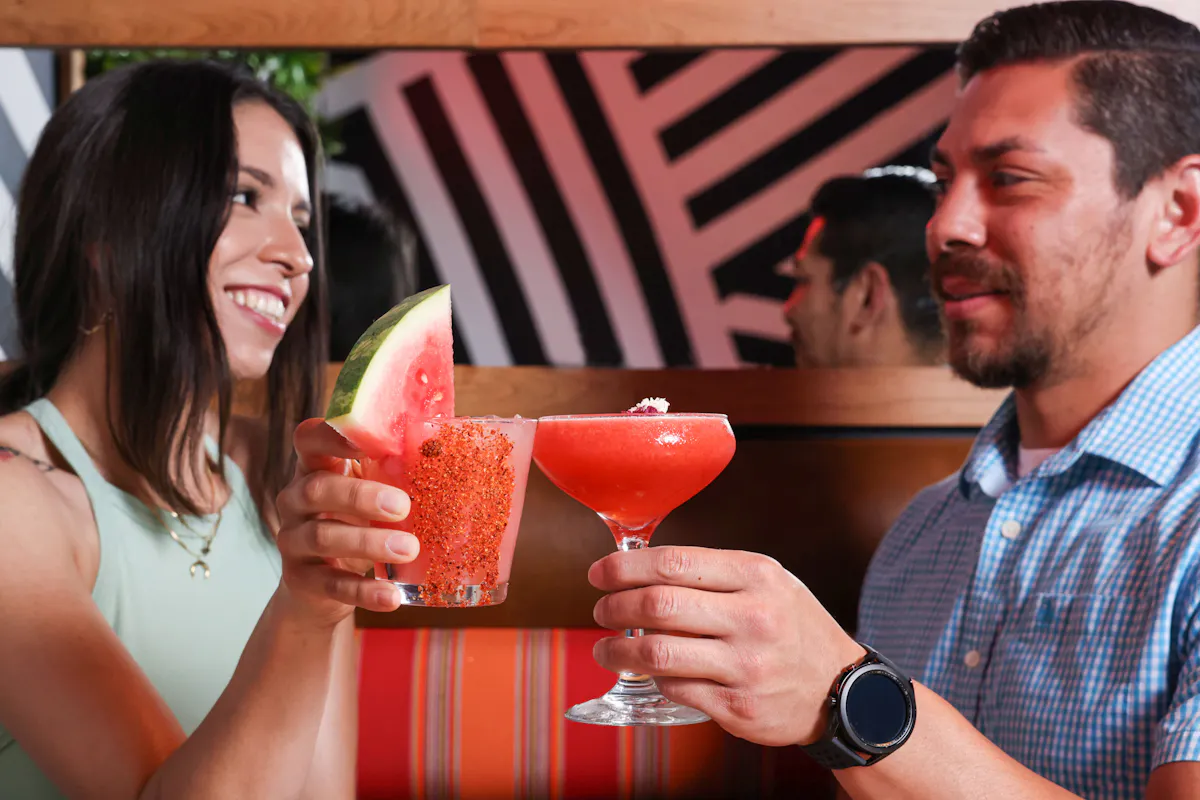 a person sitting at a table with a plate of food