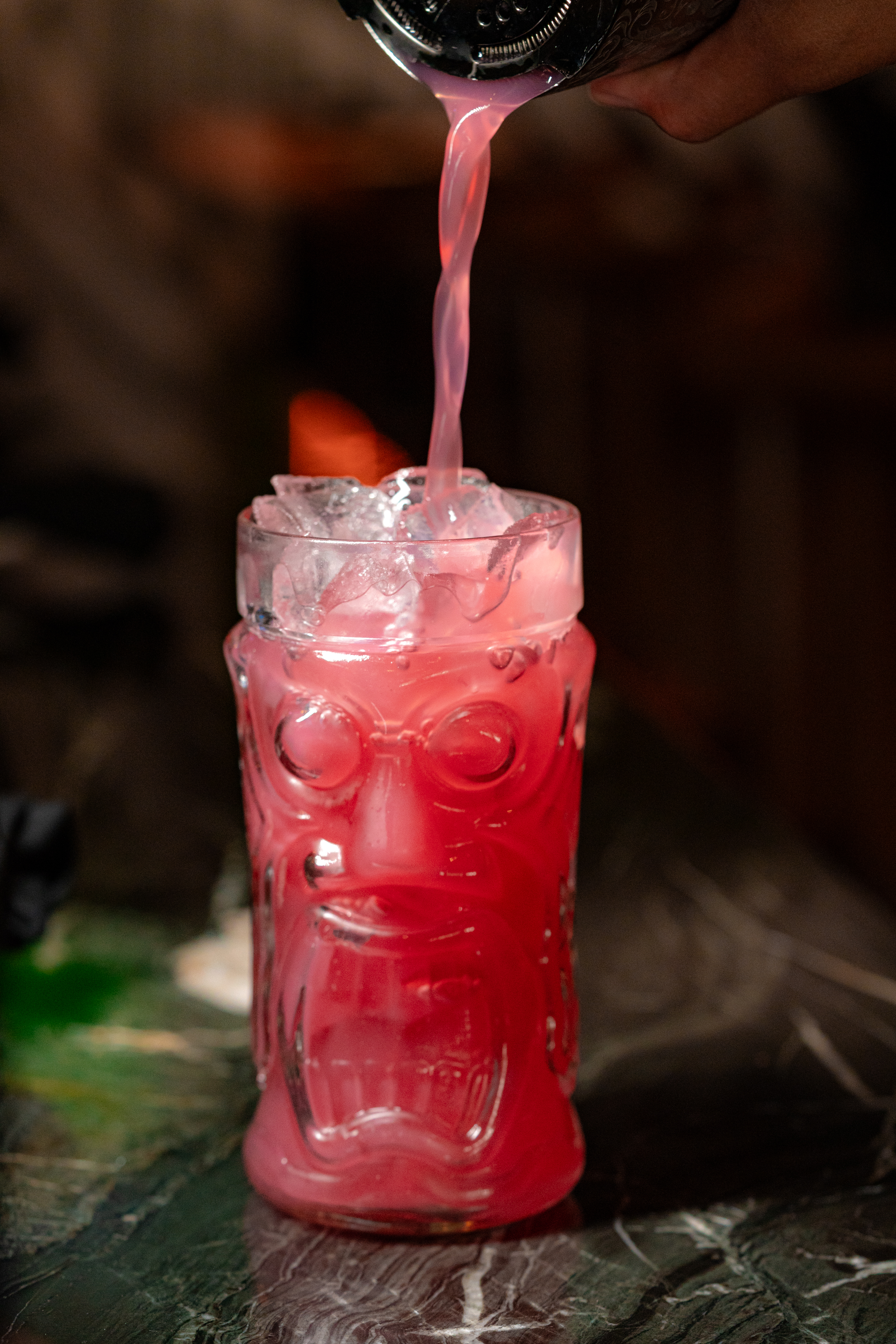 a glass with a red liquid in it