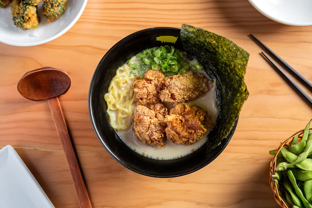 a plate of food sitting on top of a wooden table