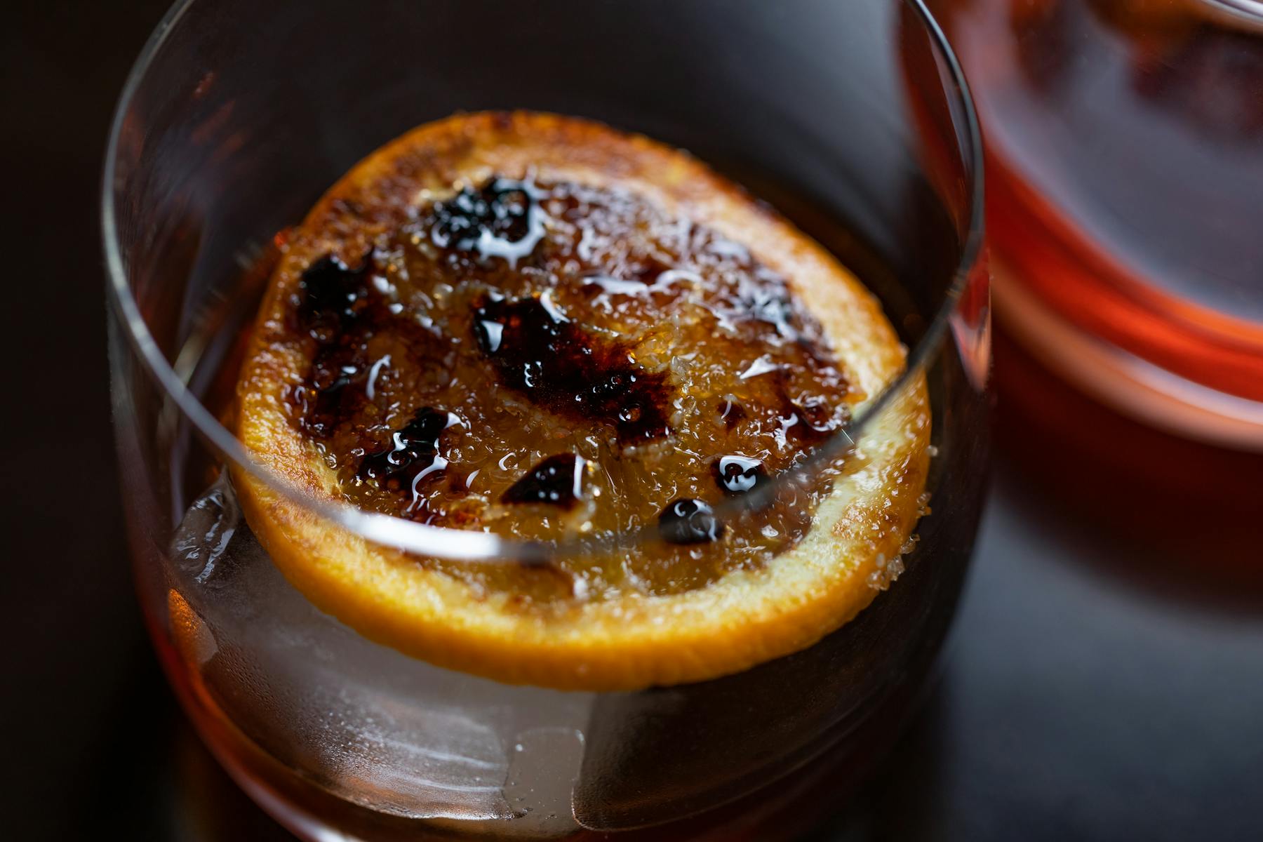 a close up of a glass of orange juice
