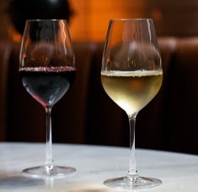 a half empty glasses of wine on a table