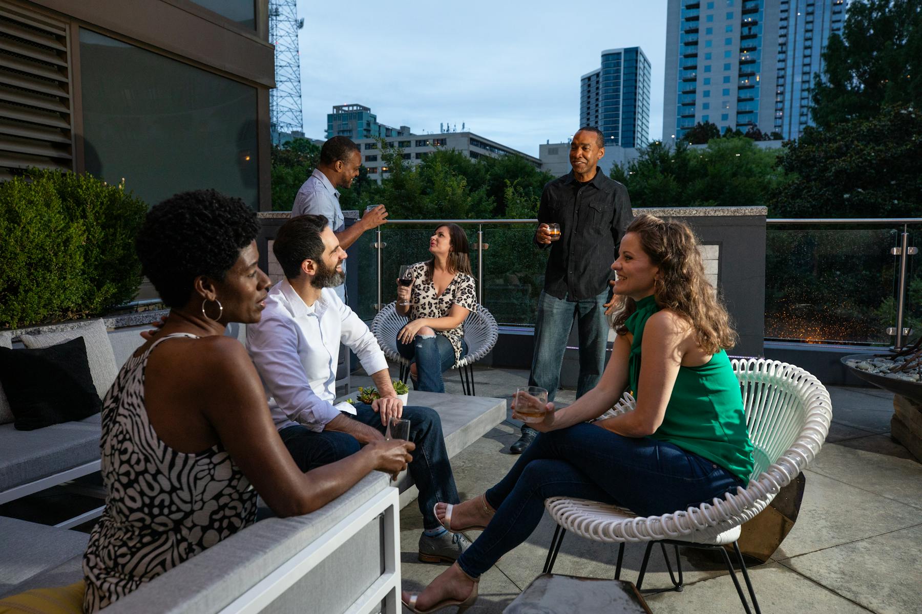 a group of people sitting in a rooftop