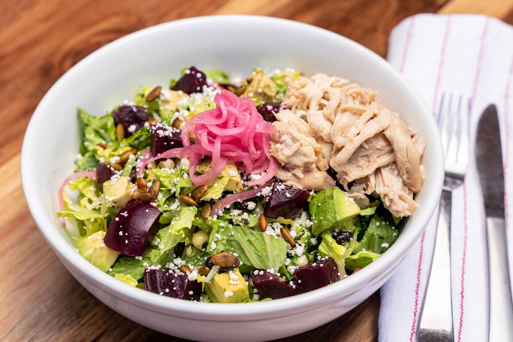 a bowl of salad on a plate