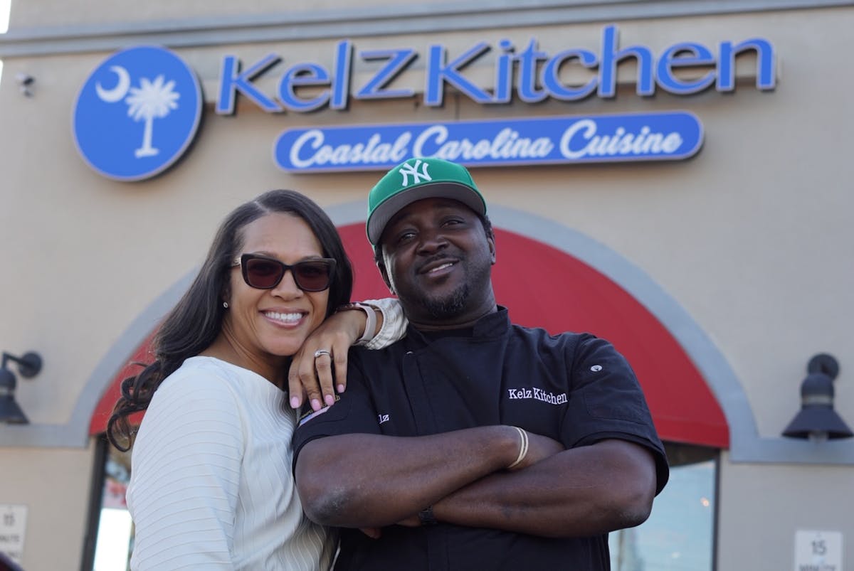 a man and a woman posing for a picture