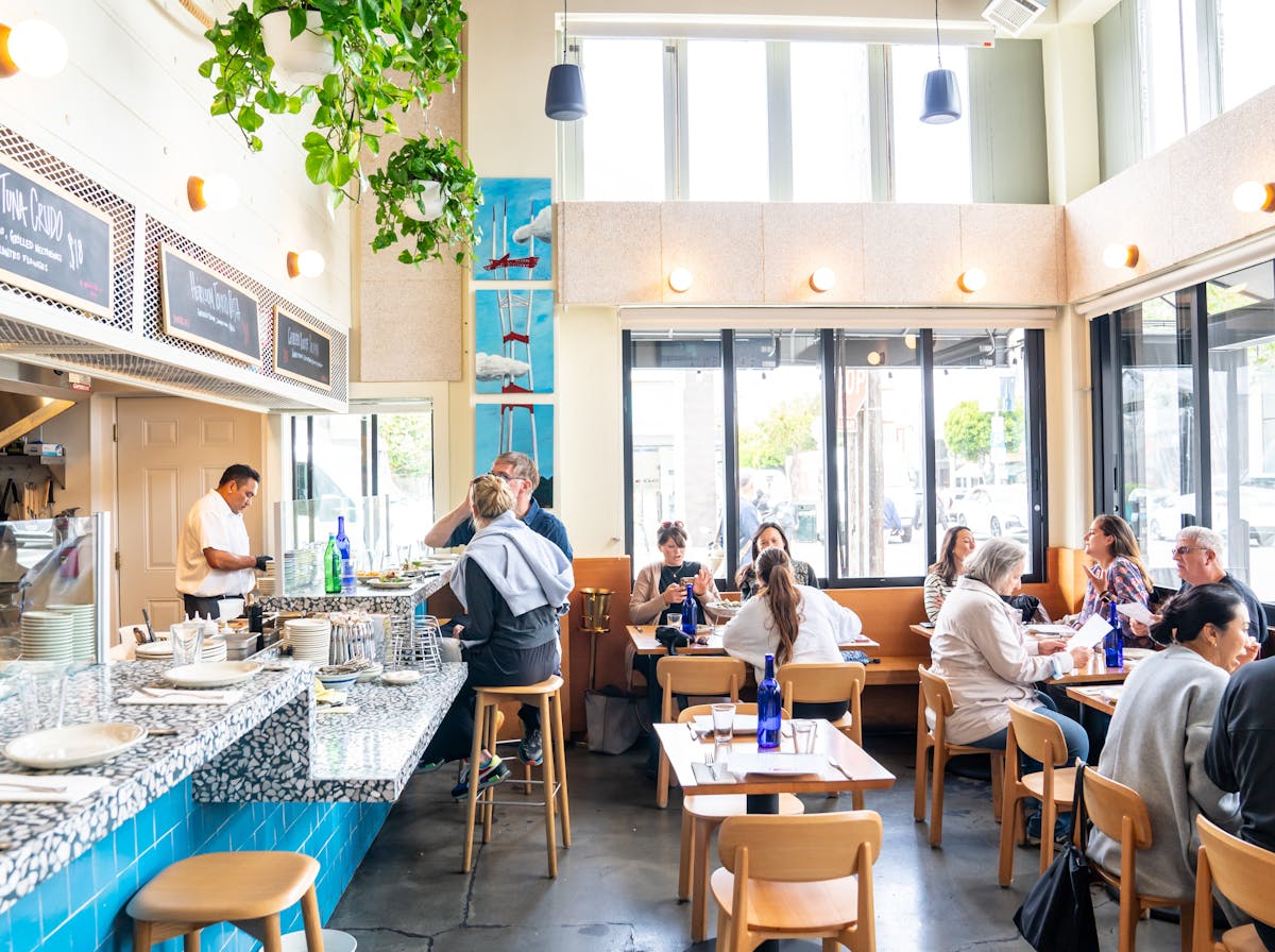 interior picture of restaurant with people sitting at tables