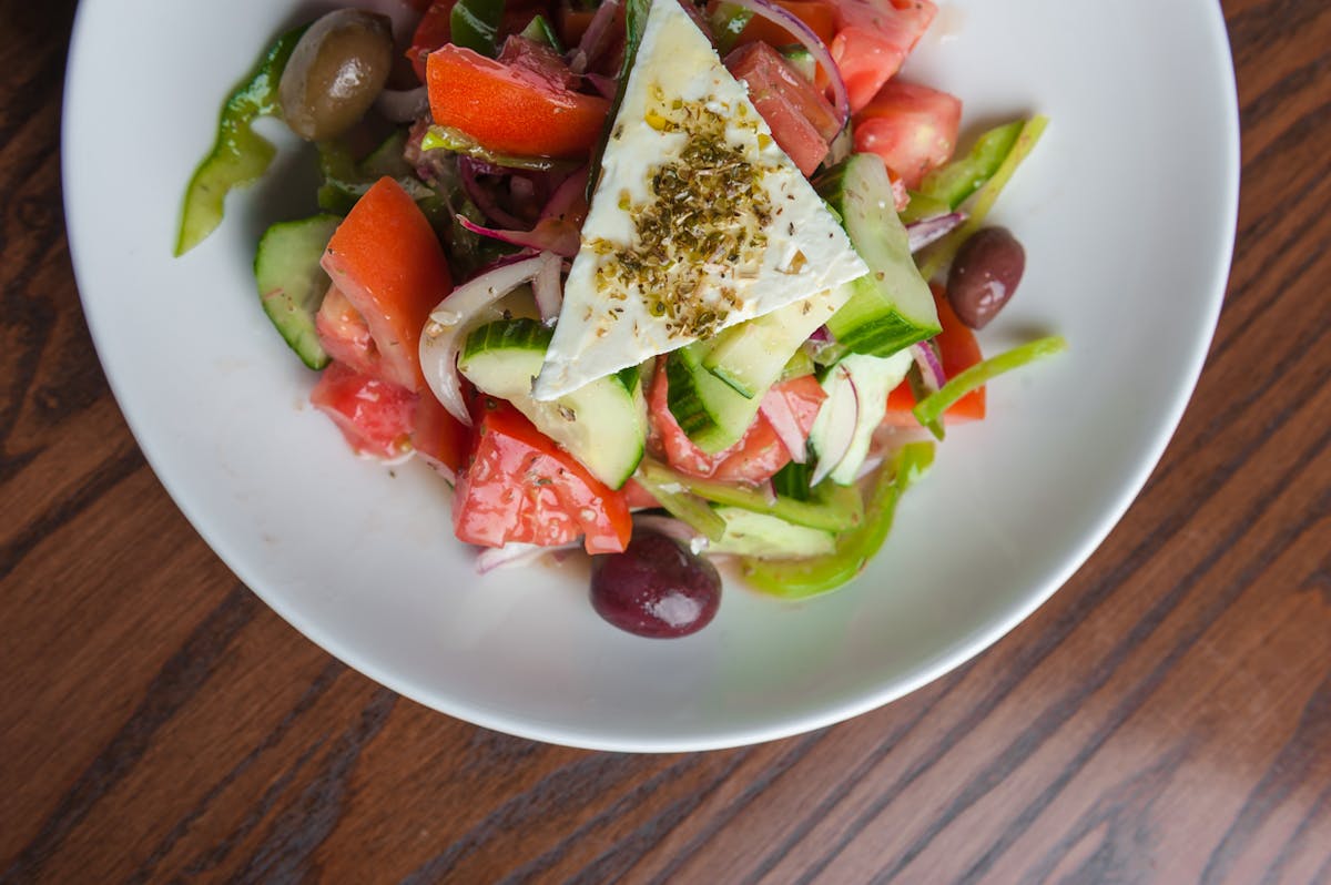 a bowl of salad on a plate