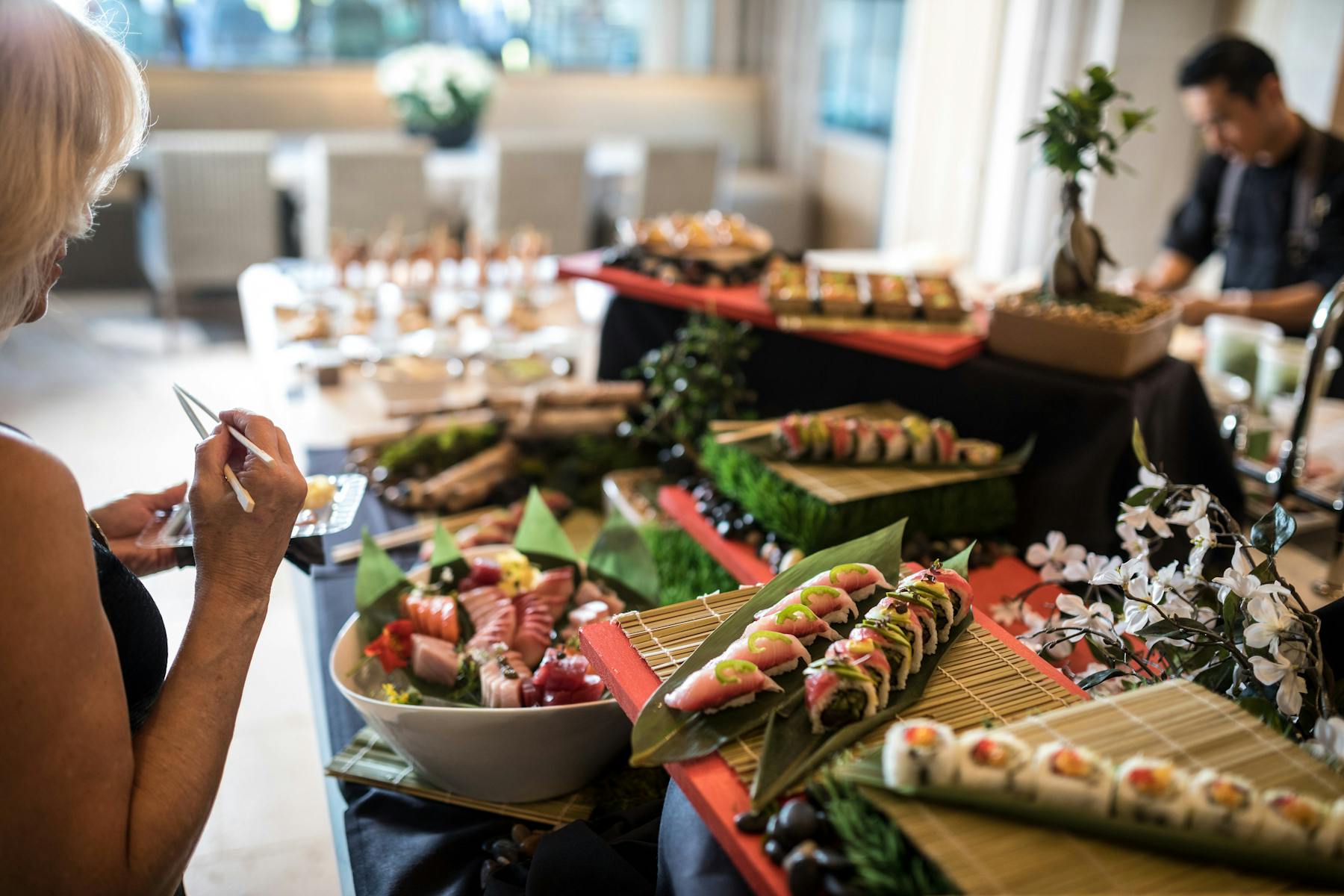 a woman sitting at a table with food