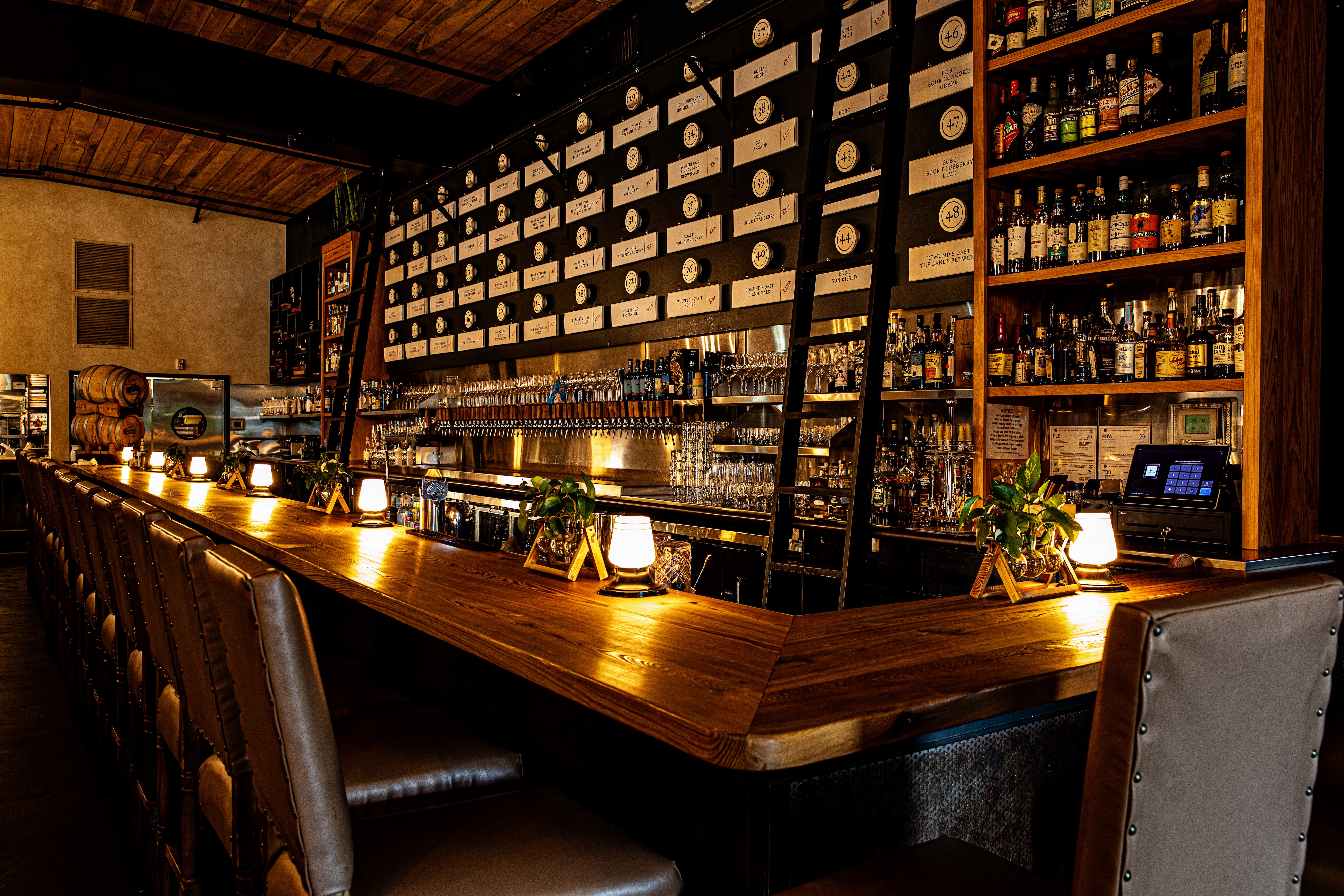 a bottle of wine sitting on top of a wooden table