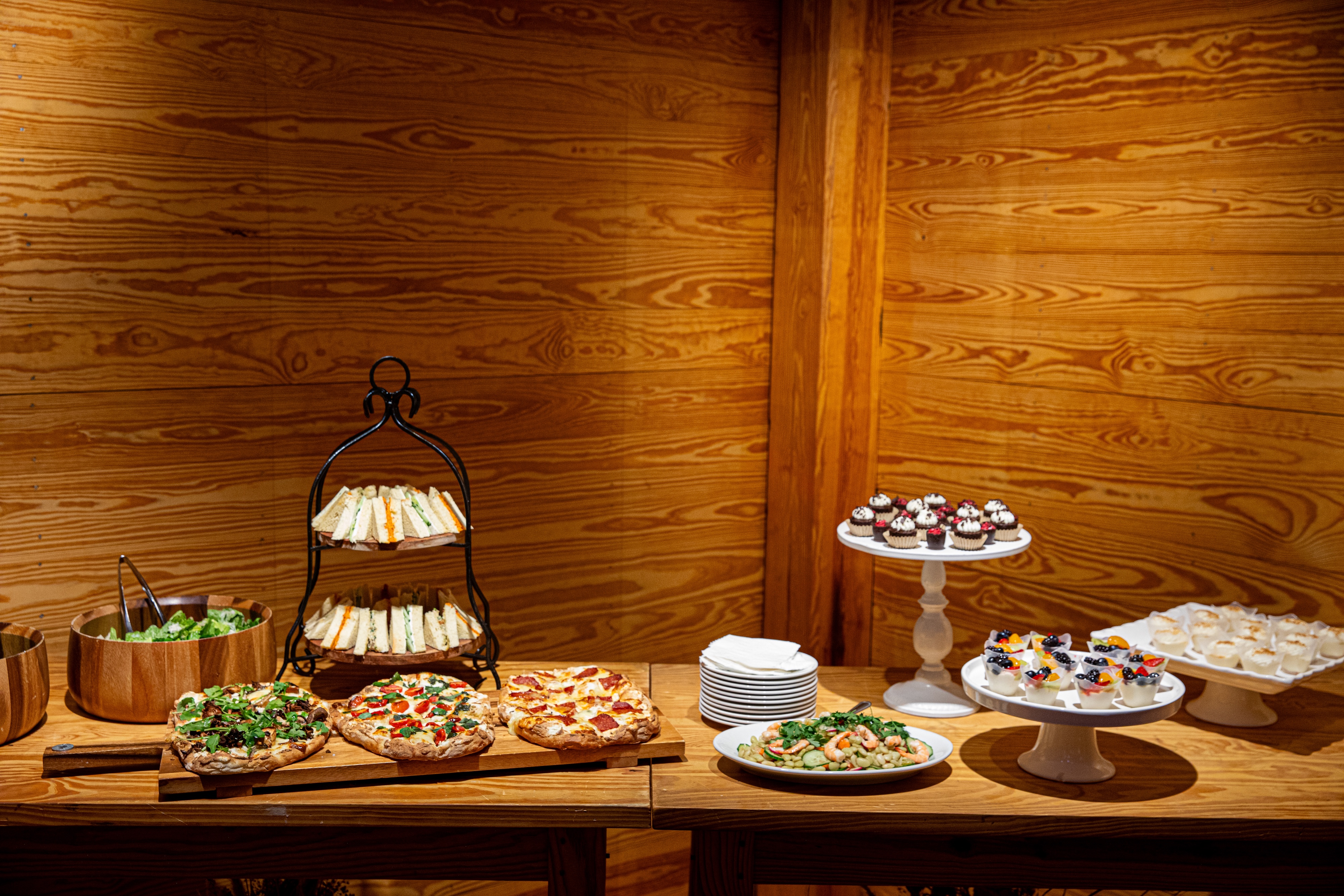 a vase of flowers sitting on top of a wooden table