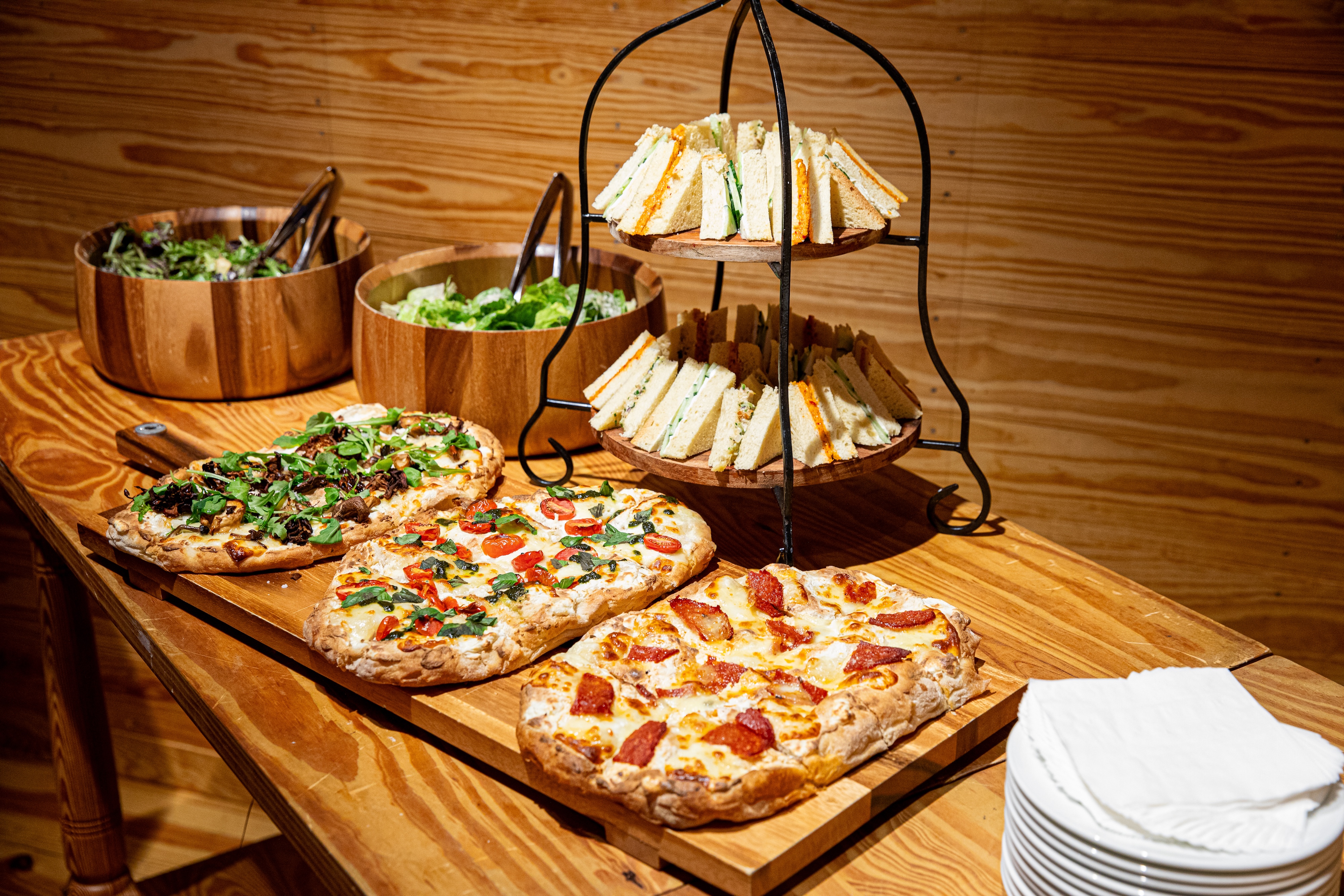 a pizza sitting on top of a wooden table