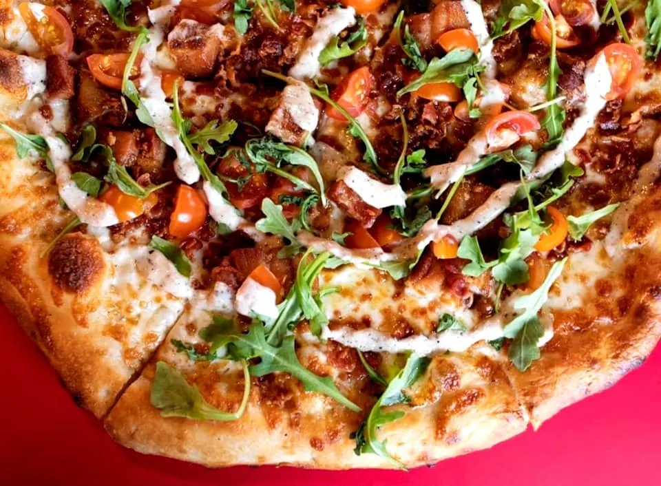 a close up of a slice of pizza