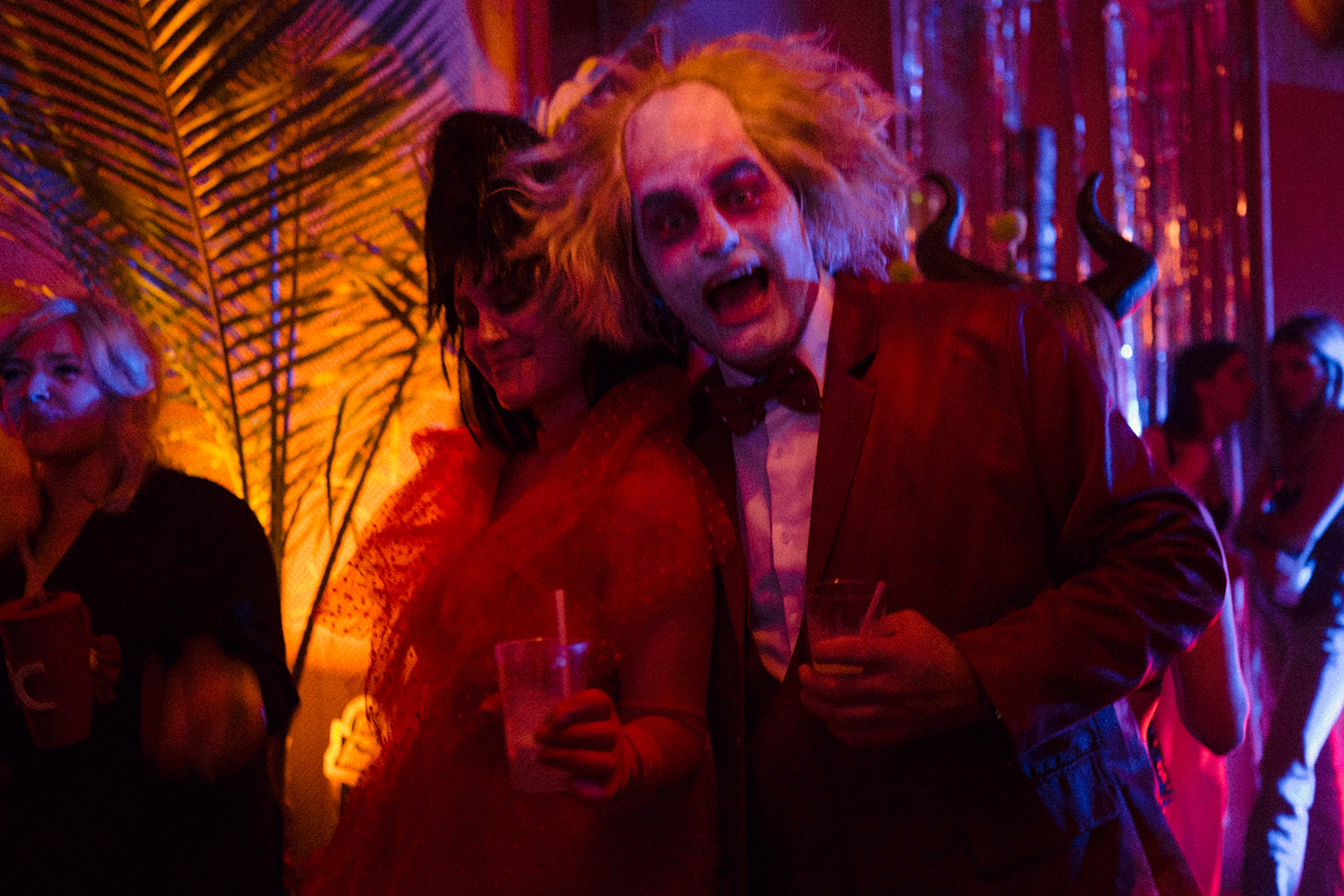 a group of people sitting at a table at night