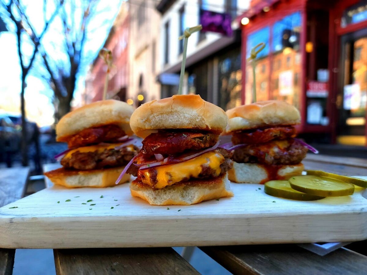 a sandwich sitting on top of a wooden table