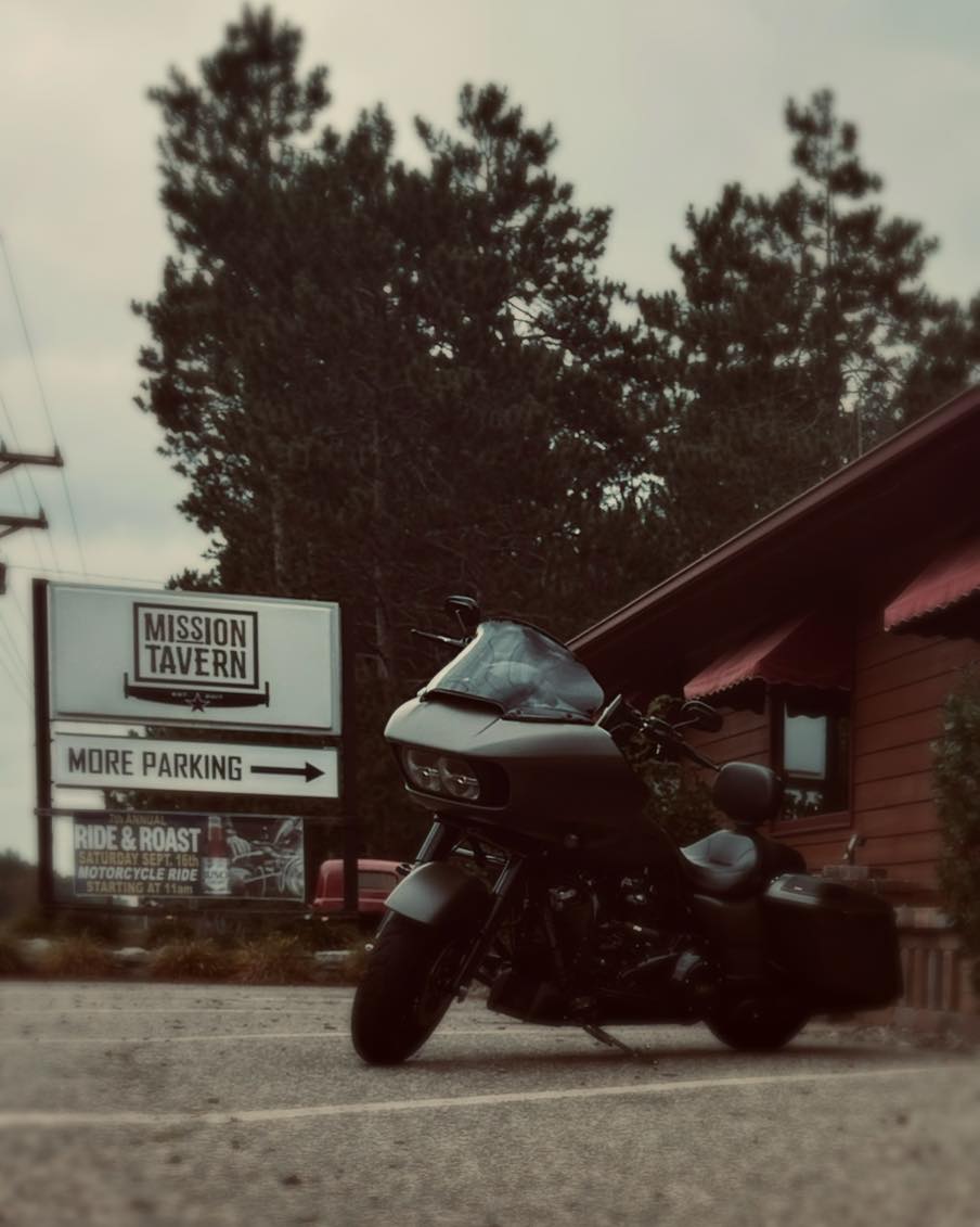 a motorcycle is parked on the side of a road