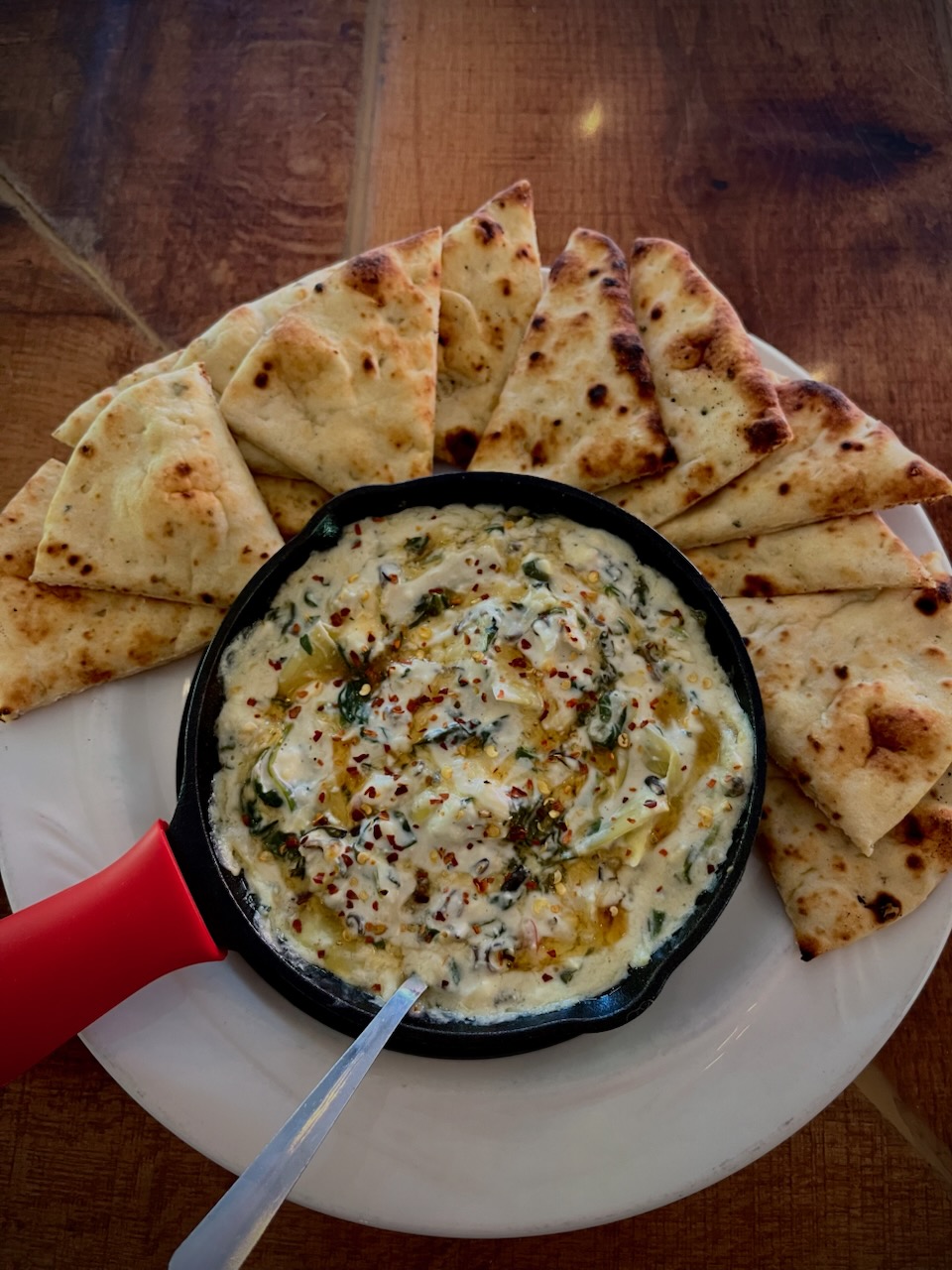 a plate of food with a slice of pizza