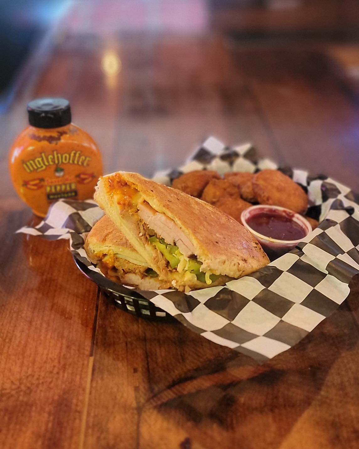 a sandwich sitting on top of a wooden table