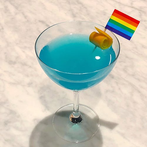 a person holding a wine glass bowl