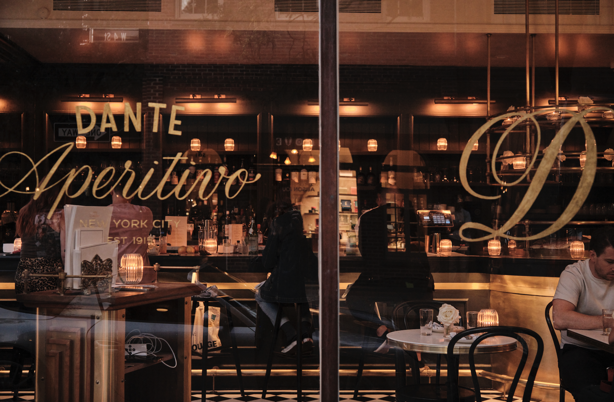 a person sitting at a table in a restaurant