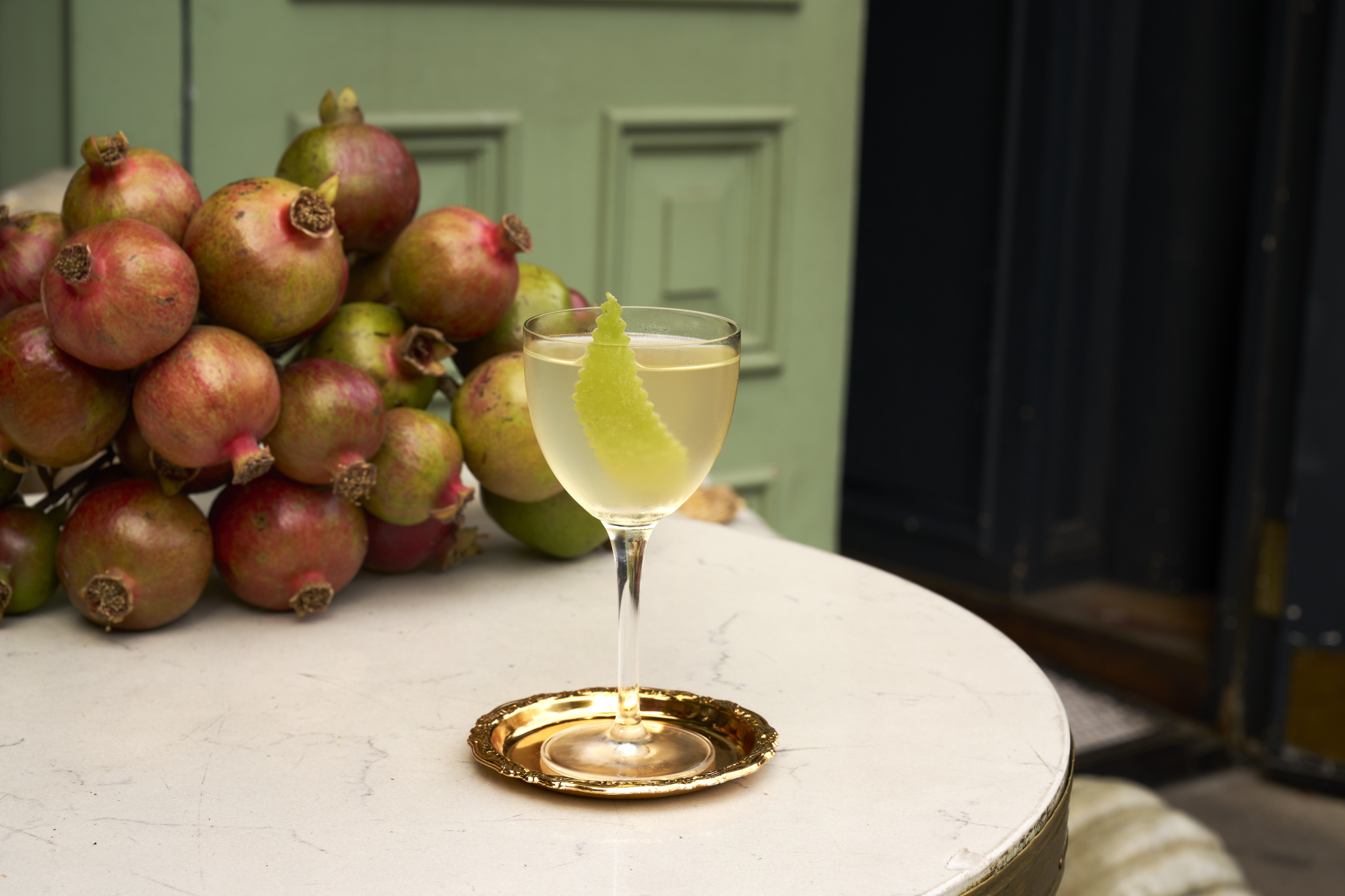 a bowl of fruit sitting on a table
