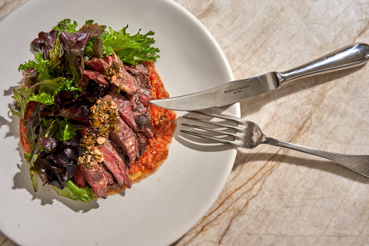 a plate of food with a fork and knife