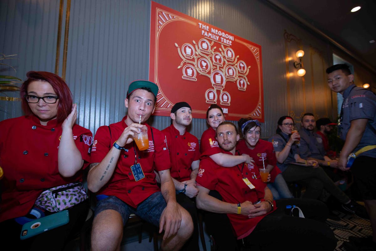 a group of people sitting posing for the camera