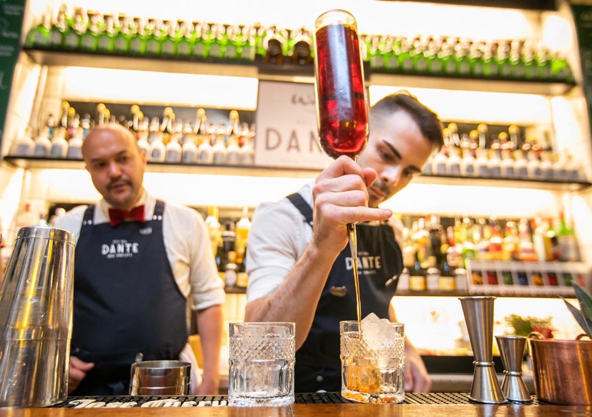 a person holding a glass of wine